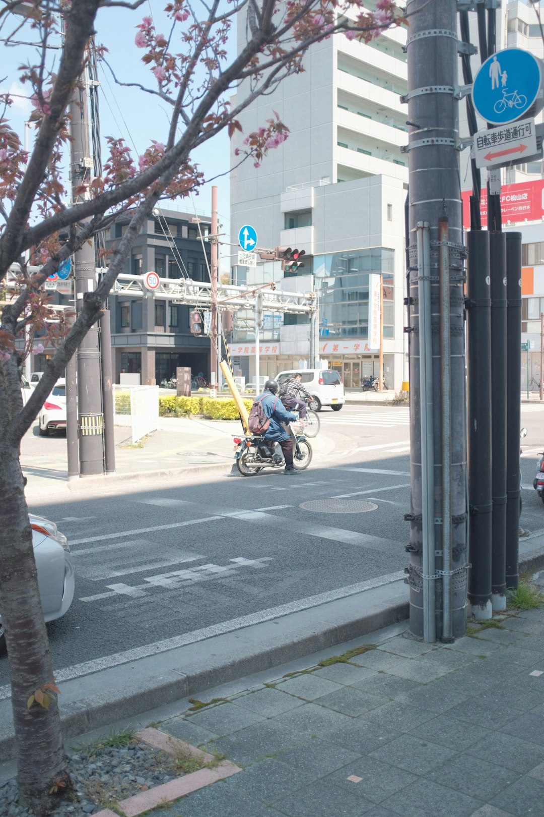 man in black jacket riding motorcycle on road during daytime