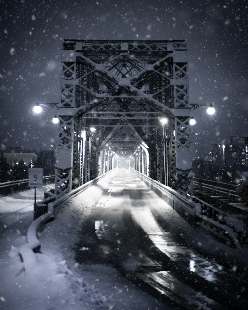 blue lighted bridge during night time