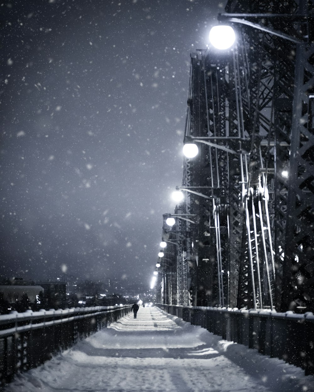 gray concrete bridge under blue sky during night time