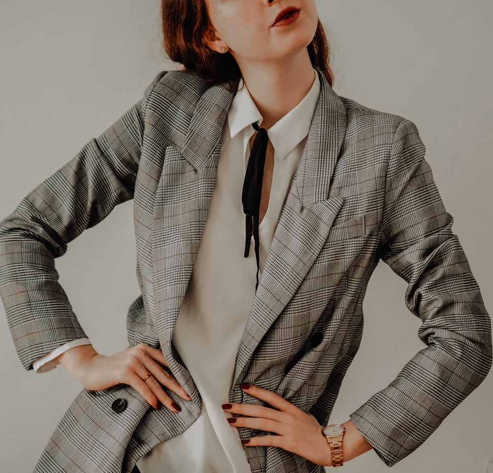 woman in gray blazer and white dress