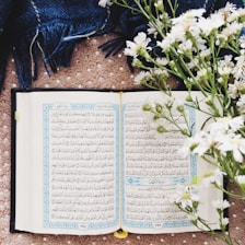 white book page on brown wooden table