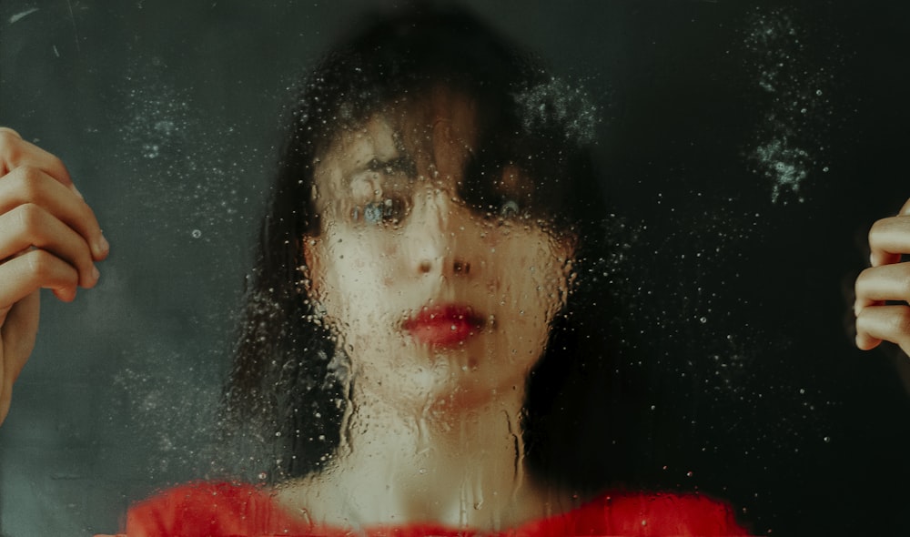 woman in red shirt with black hair