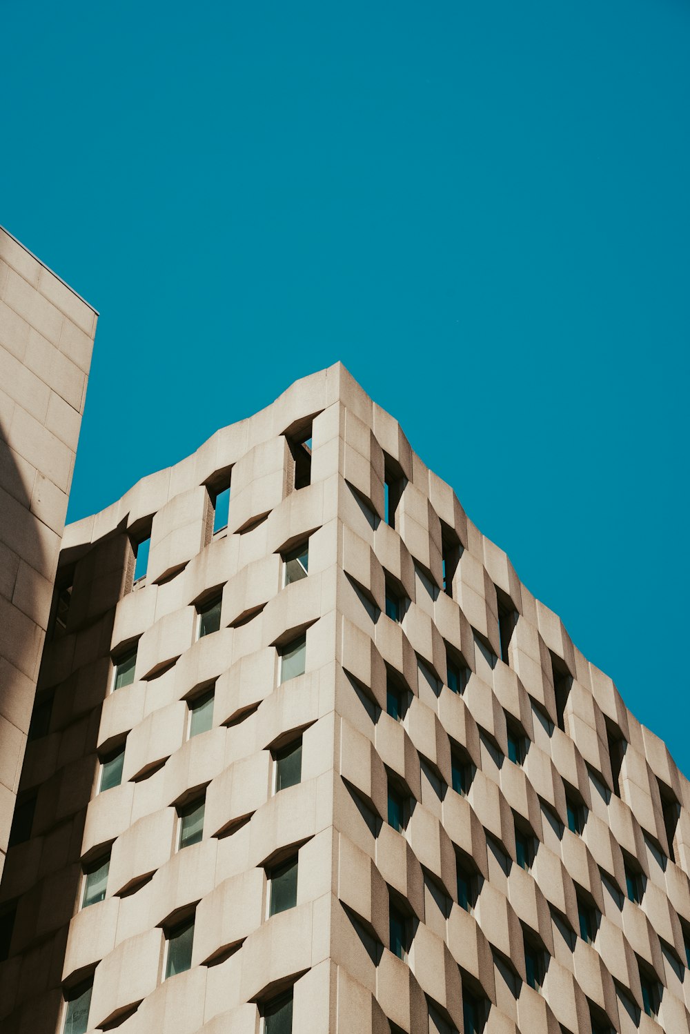 white concrete building under blue sky during daytime