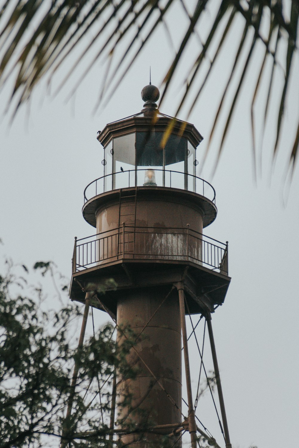 brown and white lighthouse under blue sky during daytime