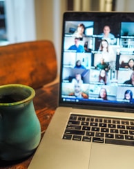 macbook pro displaying group of people