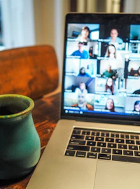 macbook pro displaying group of people