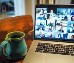 macbook pro displaying group of people