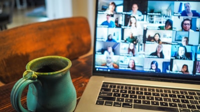 macbook pro displaying group of people