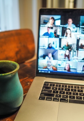 macbook pro displaying group of people