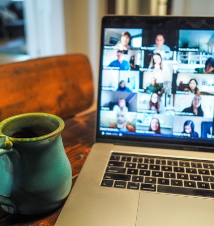 macbook pro displaying group of people