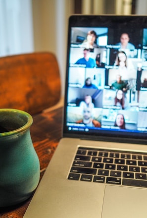 macbook pro displaying group of people