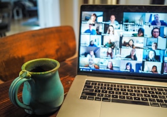 macbook pro displaying group of people