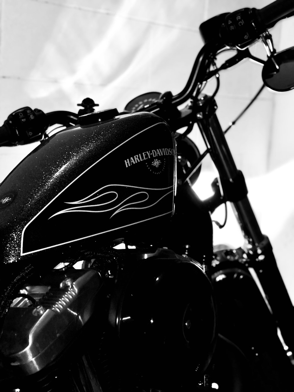 black and gray motorcycle in grayscale photography