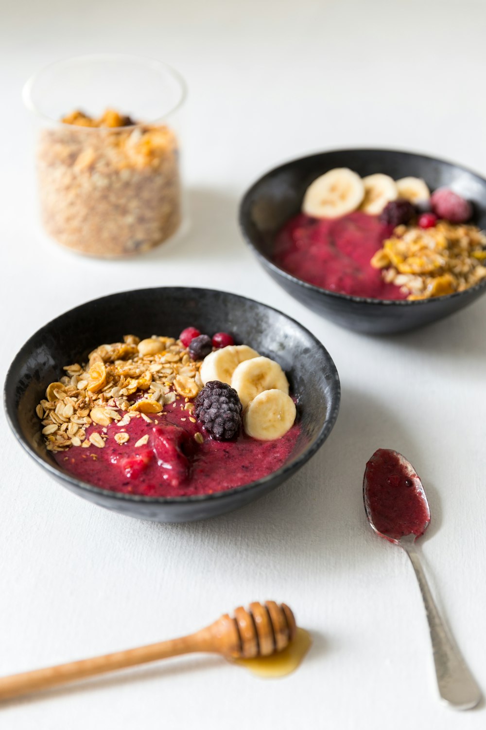 red and brown food on black ceramic bowl