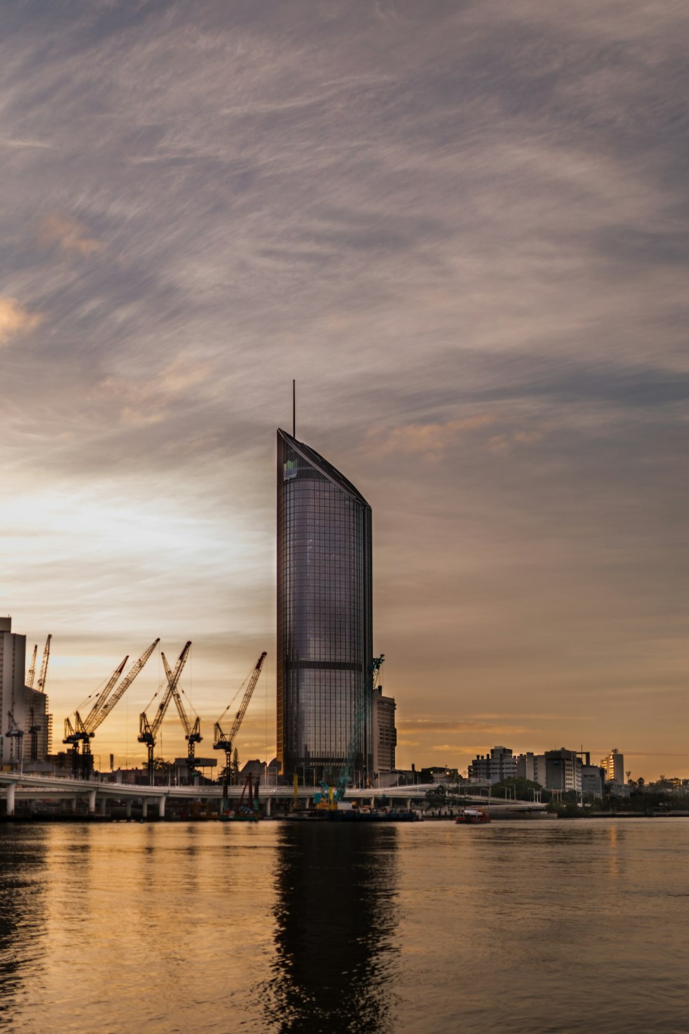 high rise building near body of water during daytime