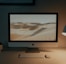 silver imac on brown wooden table