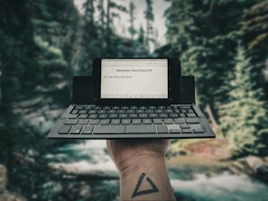 person holding black laptop computer