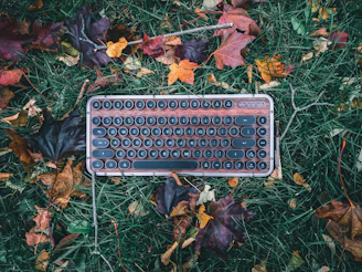 Vintage-style keyboard with round keycaps on a rustic wooden table