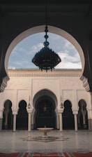 An elegant dining setup in a traditional Moroccan courtyard, reflecting luxury and cultural richness.