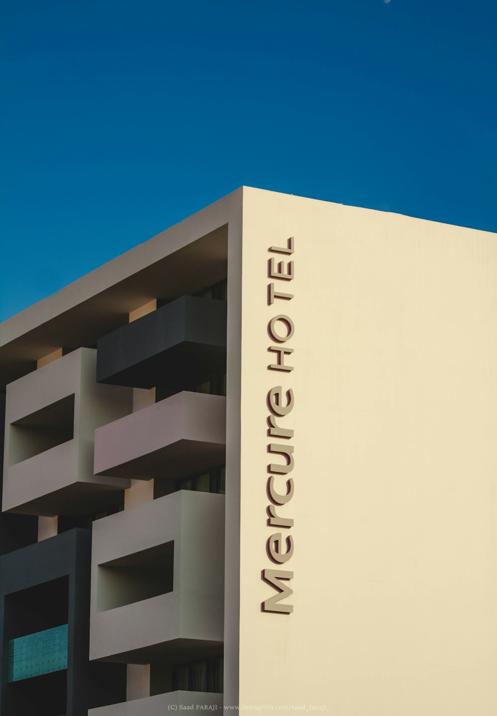 white concrete building under blue sky during daytime