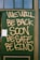 Large handwritten text in yellow spray paint reads 'WE WILL BE BACK SOON, BE SAFE, BE KIND' on a green boarded-up window. A small paper notice is taped to the bottom left corner.