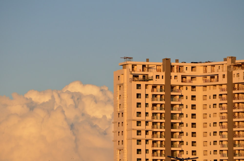 beige concrete building under blue sky during daytime