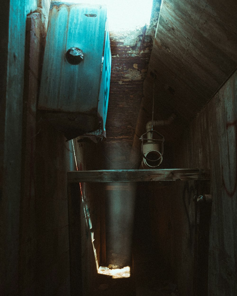 stainless steel water dispenser on brown wooden wall