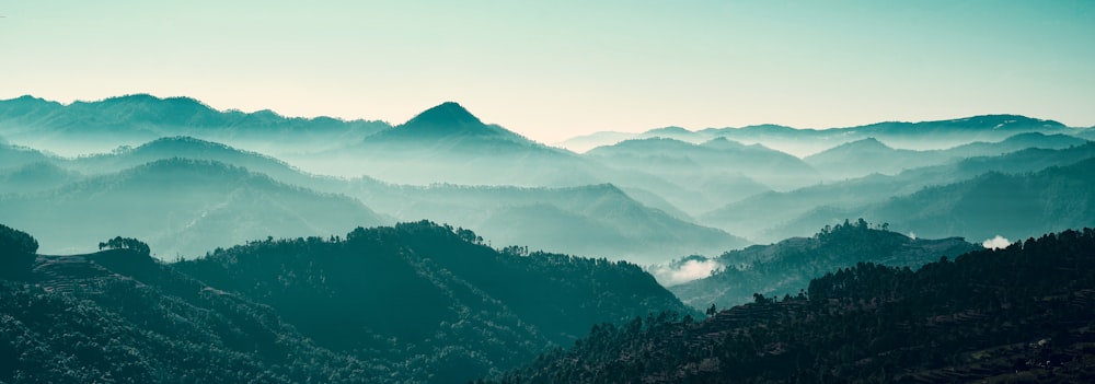 green mountains under white sky during daytime