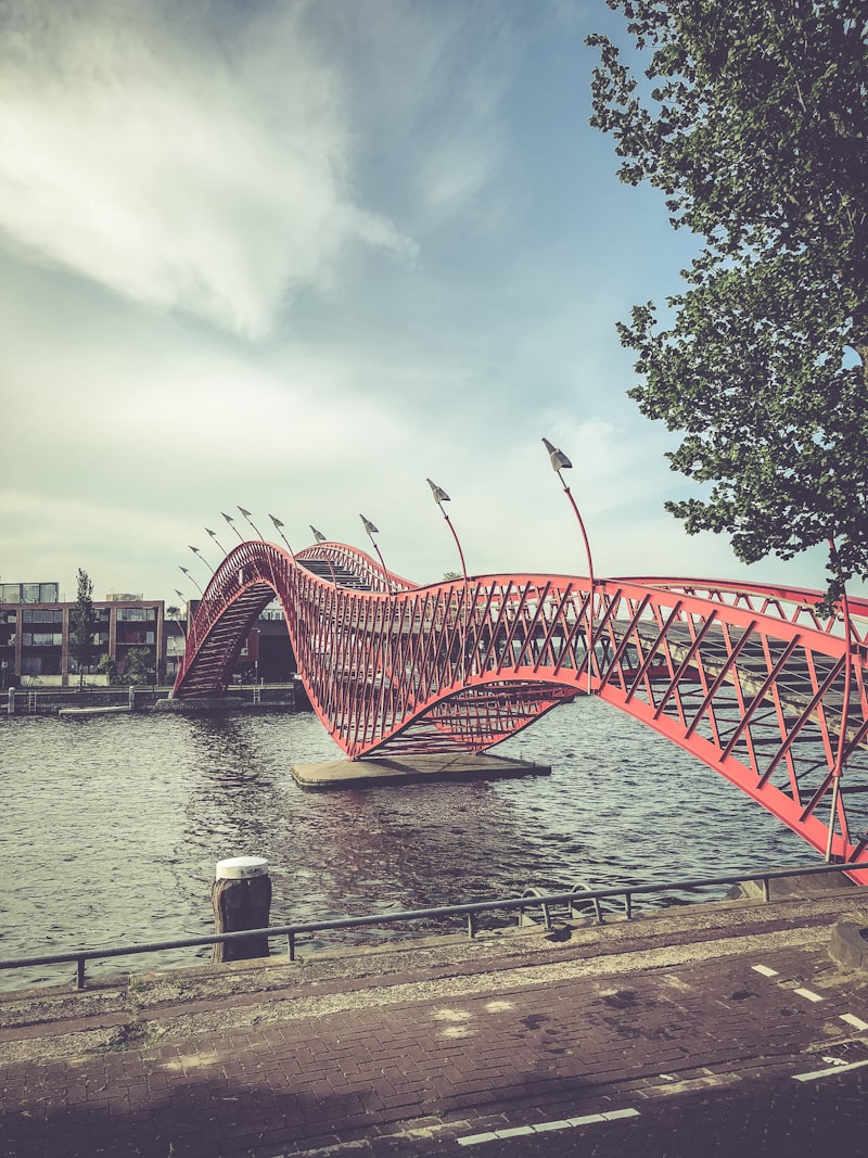 Red metal bridge in Eastern Docklands Amsterdam