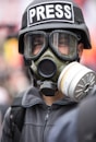 person wearing black and white gas mask