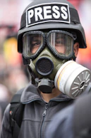 person wearing black and white gas mask