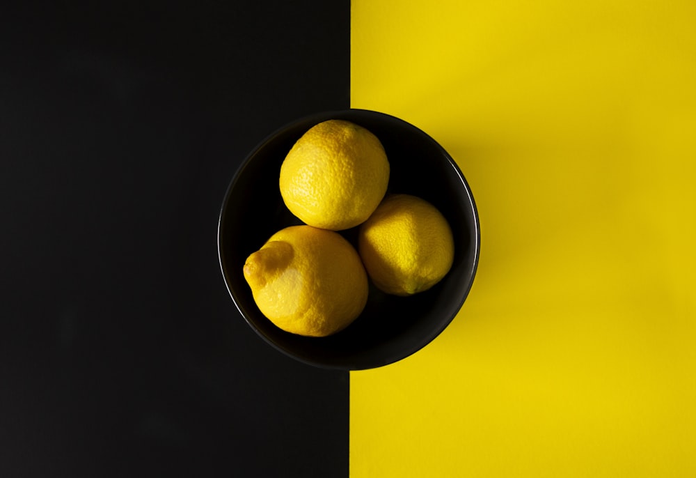 yellow lemon fruit on yellow surface