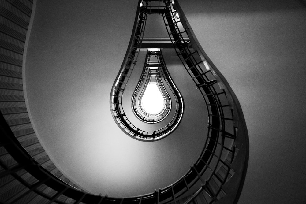 spiral staircase in grayscale photography