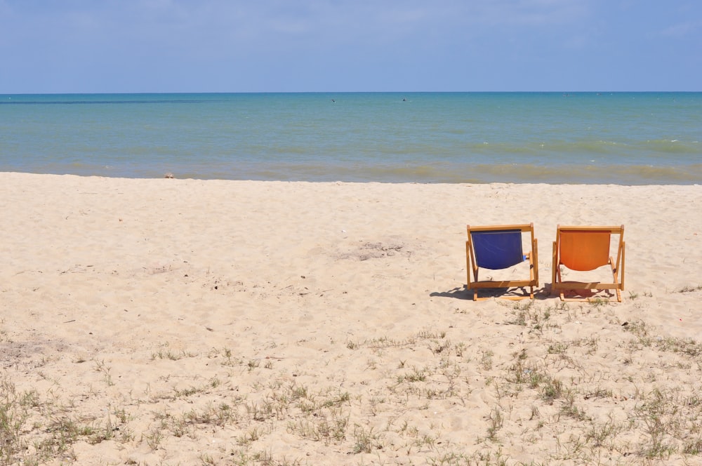 blue and brown chair on beach during daytime