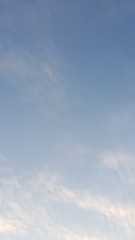 A minimalist composition of a vast horizon under a pale sky, evoking openness.