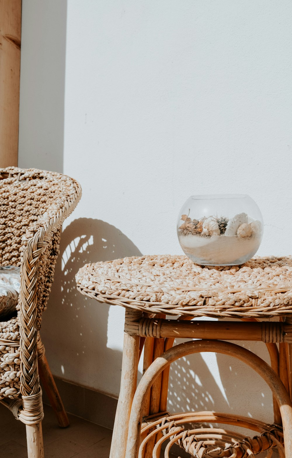 clear glass bowl on brown woven table