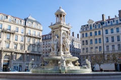 white concrete building with fountain