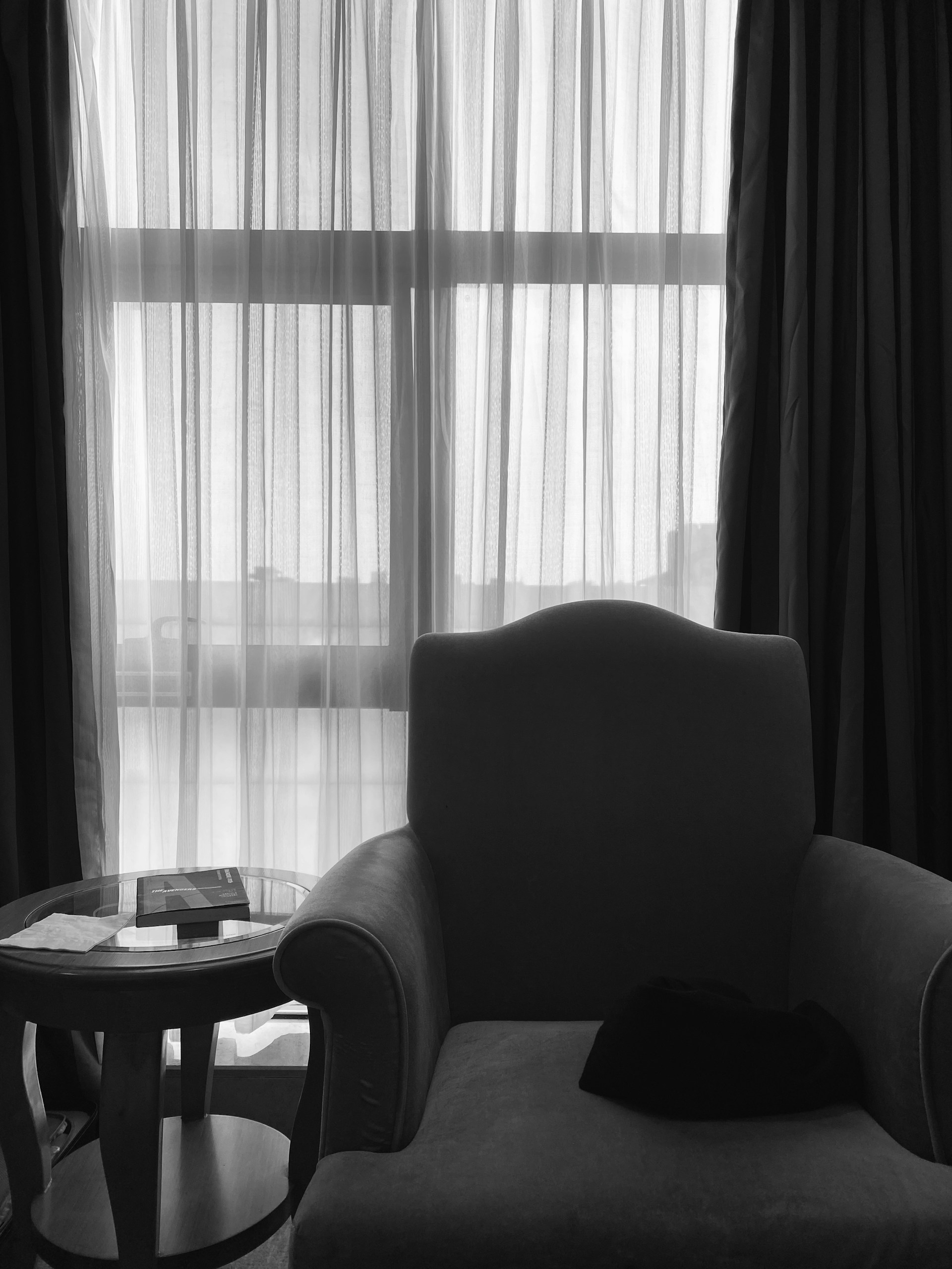 white window curtain near white table