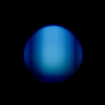 A soft light blue background with a circular light therapy patch glowing gently, surrounded by sun rays.