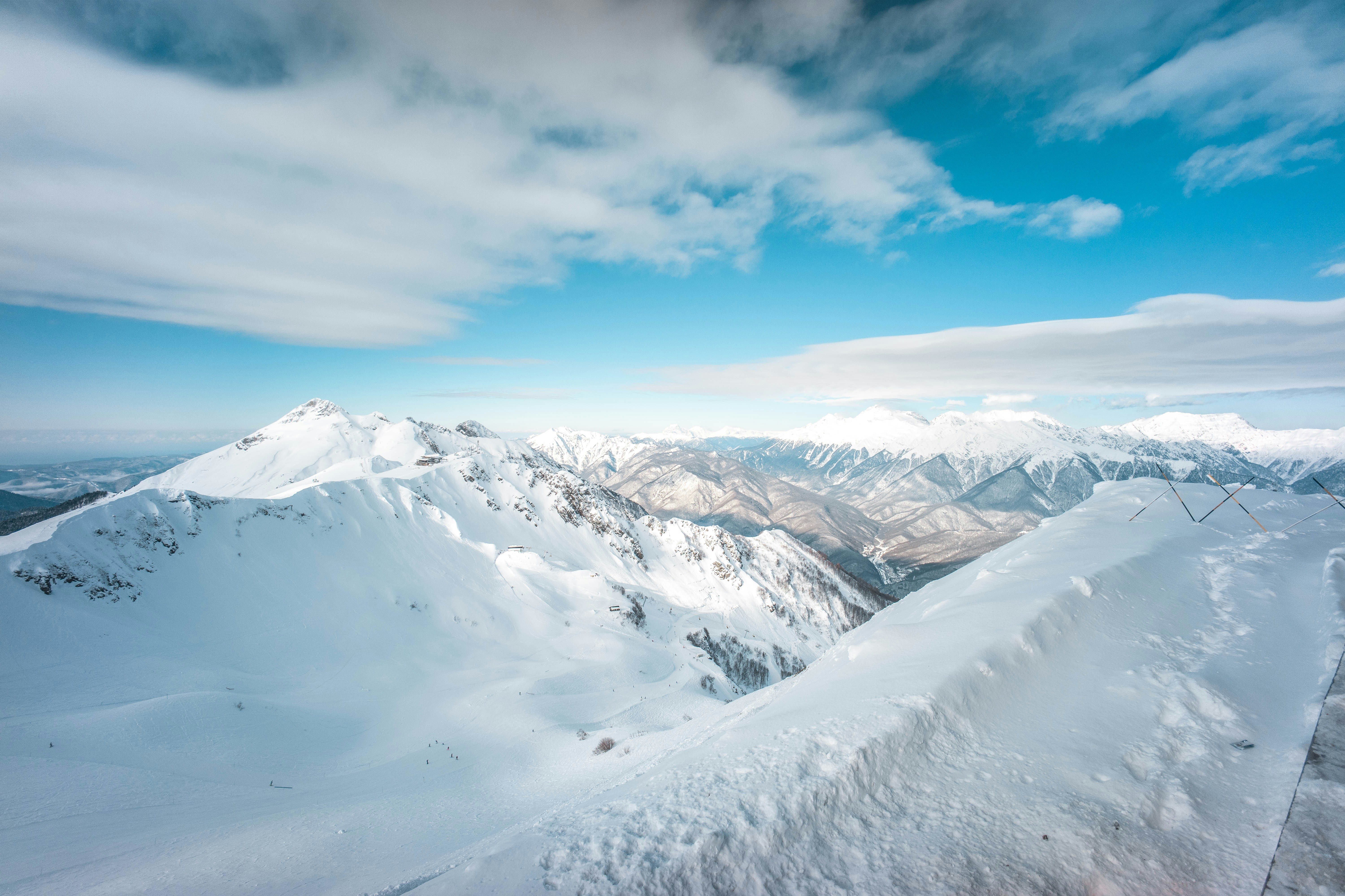 snow covered mountain under blue sky during daytime