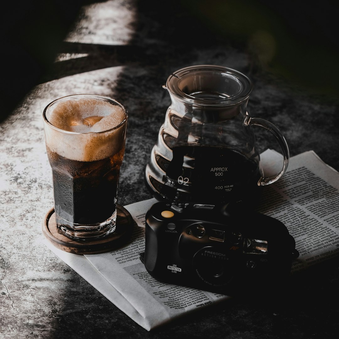 clear glass mug on black and white table