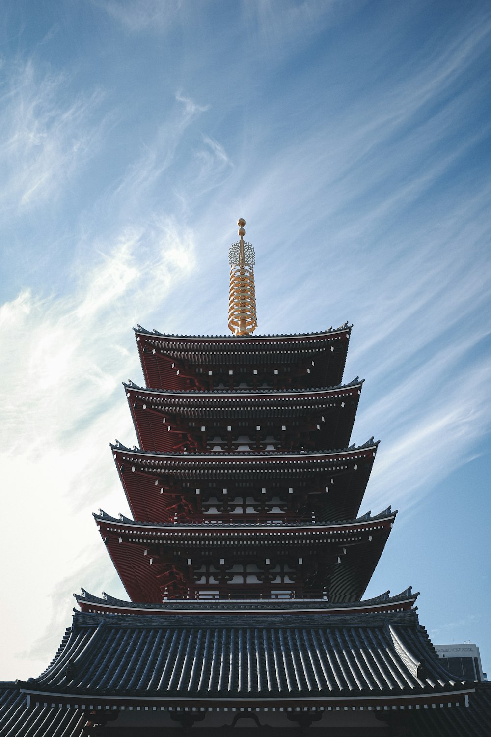 red and black tower under blue sky during daytime