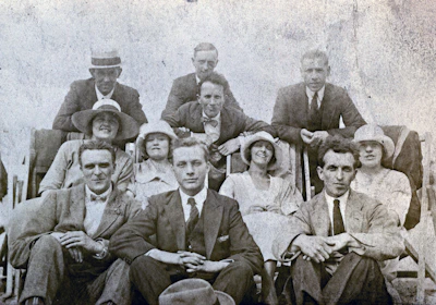A vintage group photo from the 1940s, enhanced to remove scratches and bring out the faces clearly against a soft background.