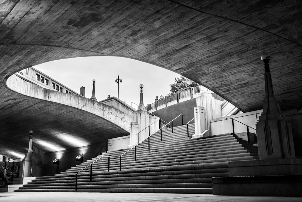 grayscale photo of concrete bridge