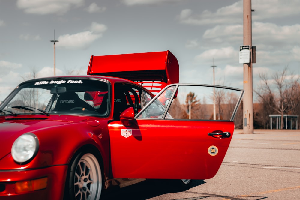 red ferrari 458 italia parked on parking lot during daytime