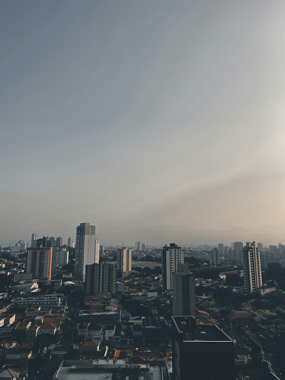 city skyline under gray sky during daytime