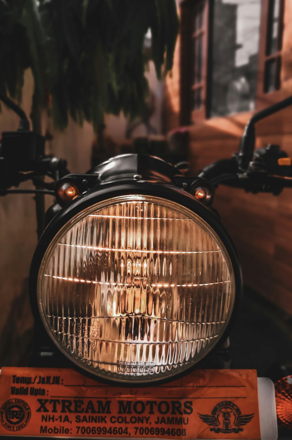 a close up of a headlight on a motorcycle