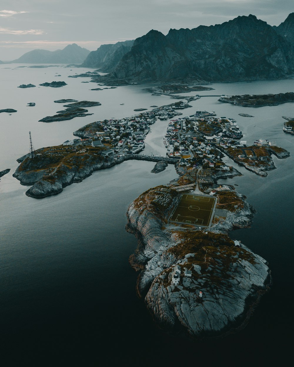 brown and white rock formation on body of water