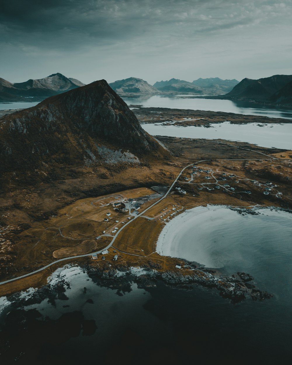 aerial view of road near mountain during daytime