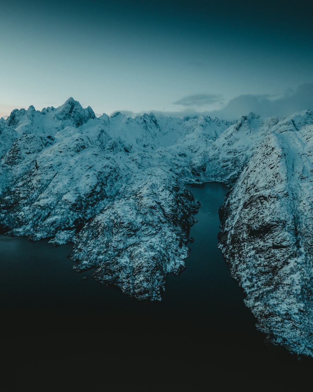 snow covered mountain during daytime